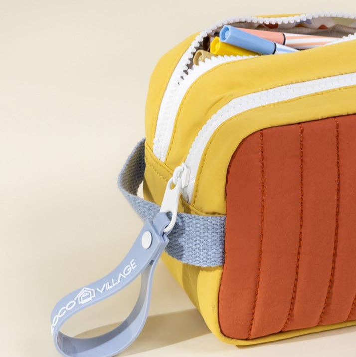 Multicolored pouch with a strap on a beige background