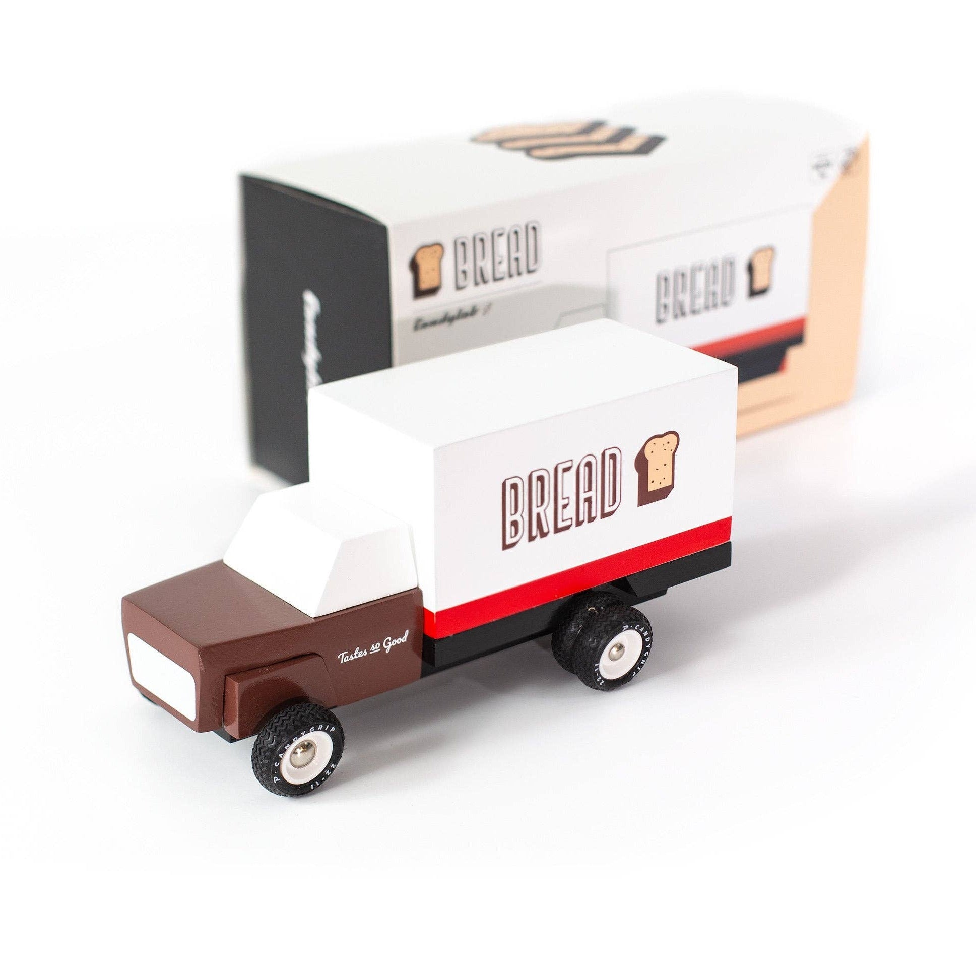 Toy bread truck with a box of bread on a white background