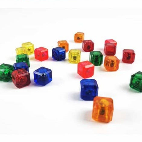 Colorful transparent dice cubes on a white background