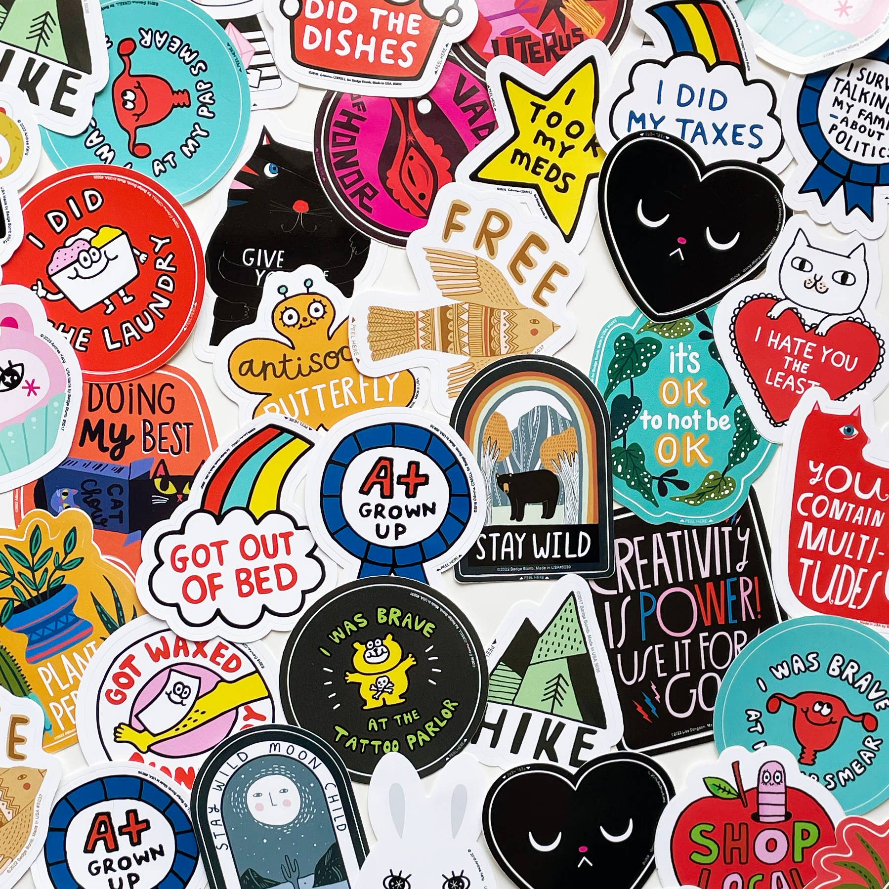 Collection of various colorful stickers with different designs and text.