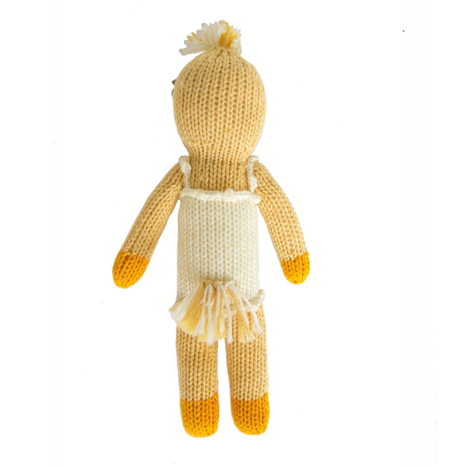 Knitted doll with a white dress and yellow accents on a white background