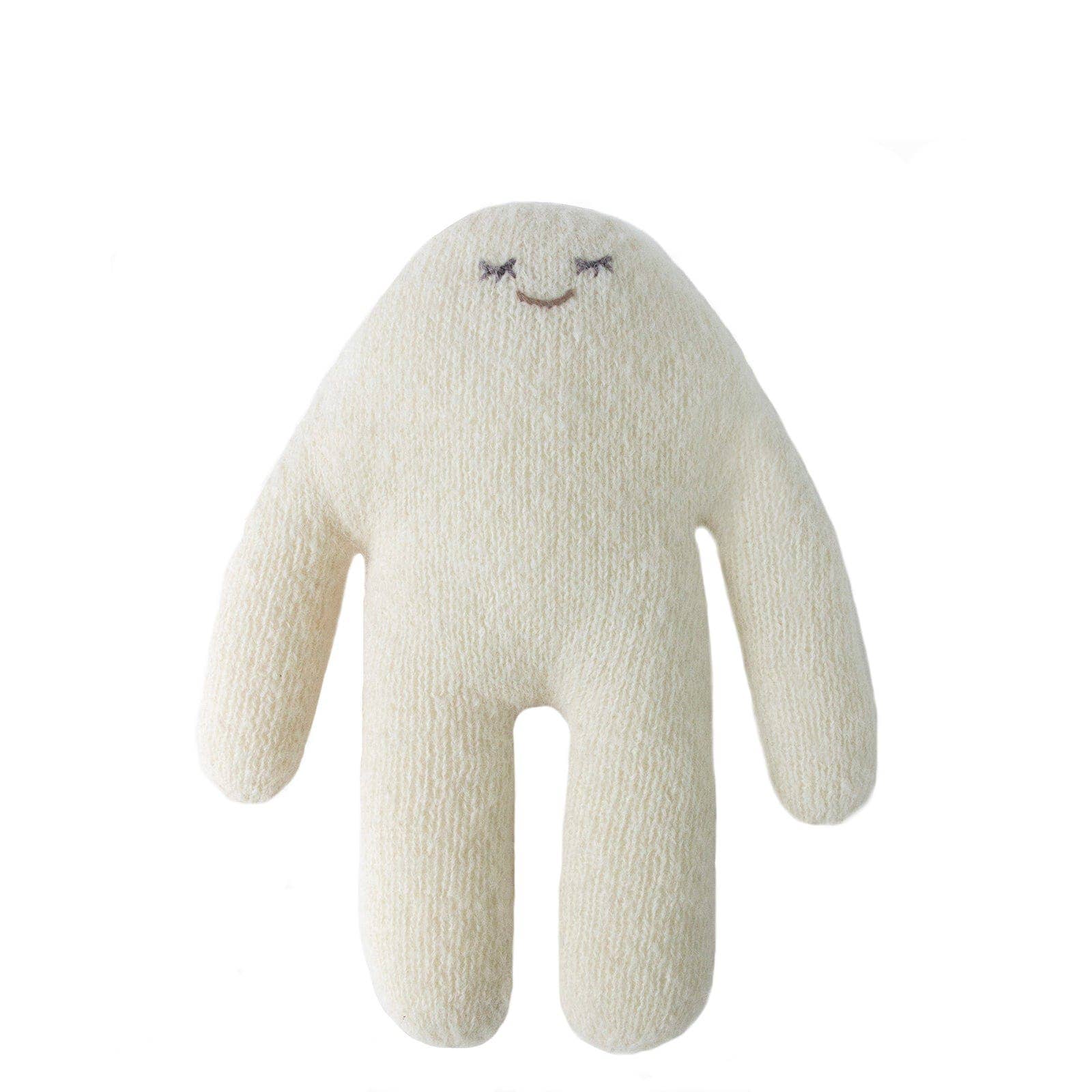 White plush toy with a smiling face on a white background