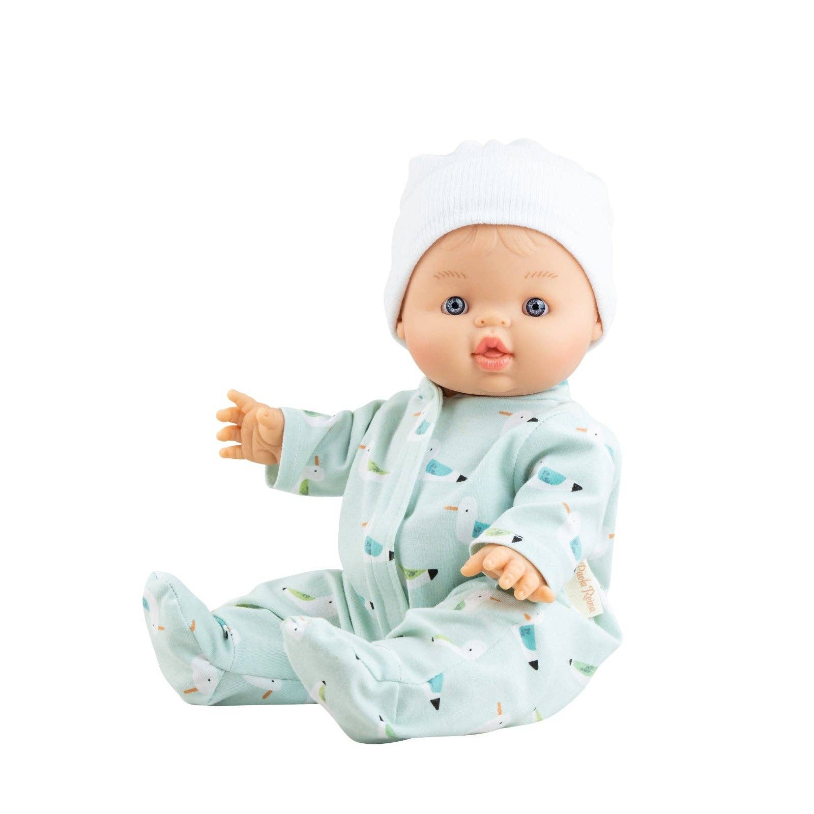 Baby doll in a light blue outfit with a white hat on a white background