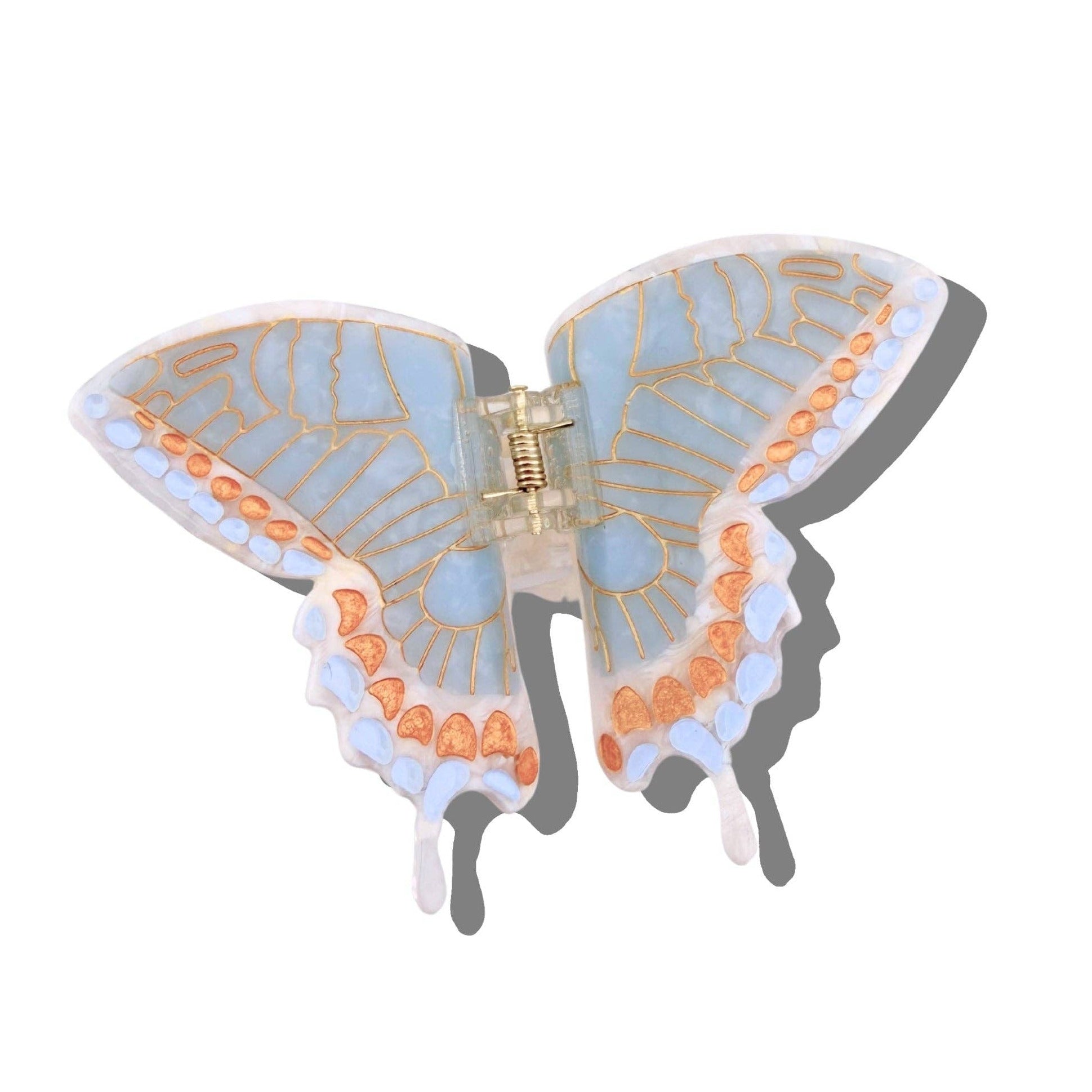Butterfly-shaped hair clip with blue and orange design on a white background