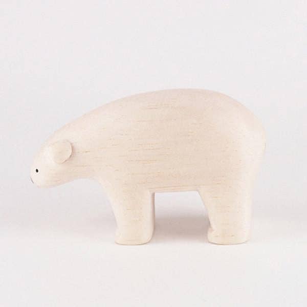 White bear-shaped object on a light gray background