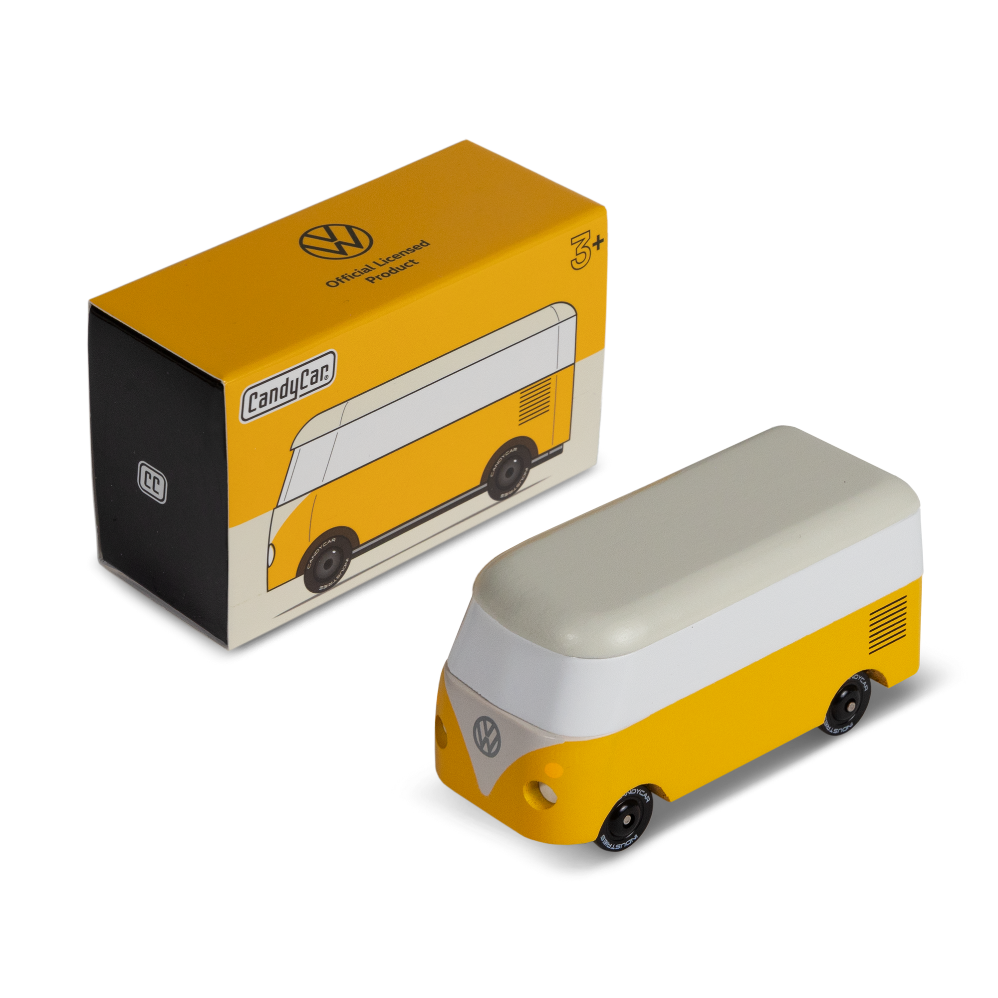 Yellow and white model van next to its packaging on a white background