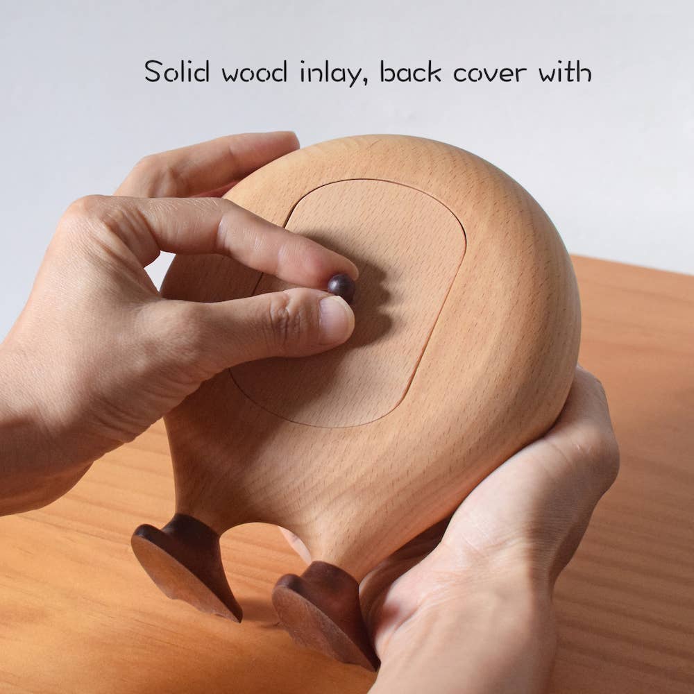 Wooden product with a hand holding it, showcasing a solid wood inlay.