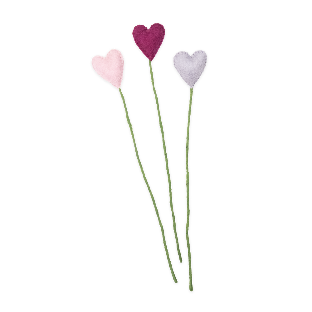 Three heart-shaped flowers on green stems against a white background