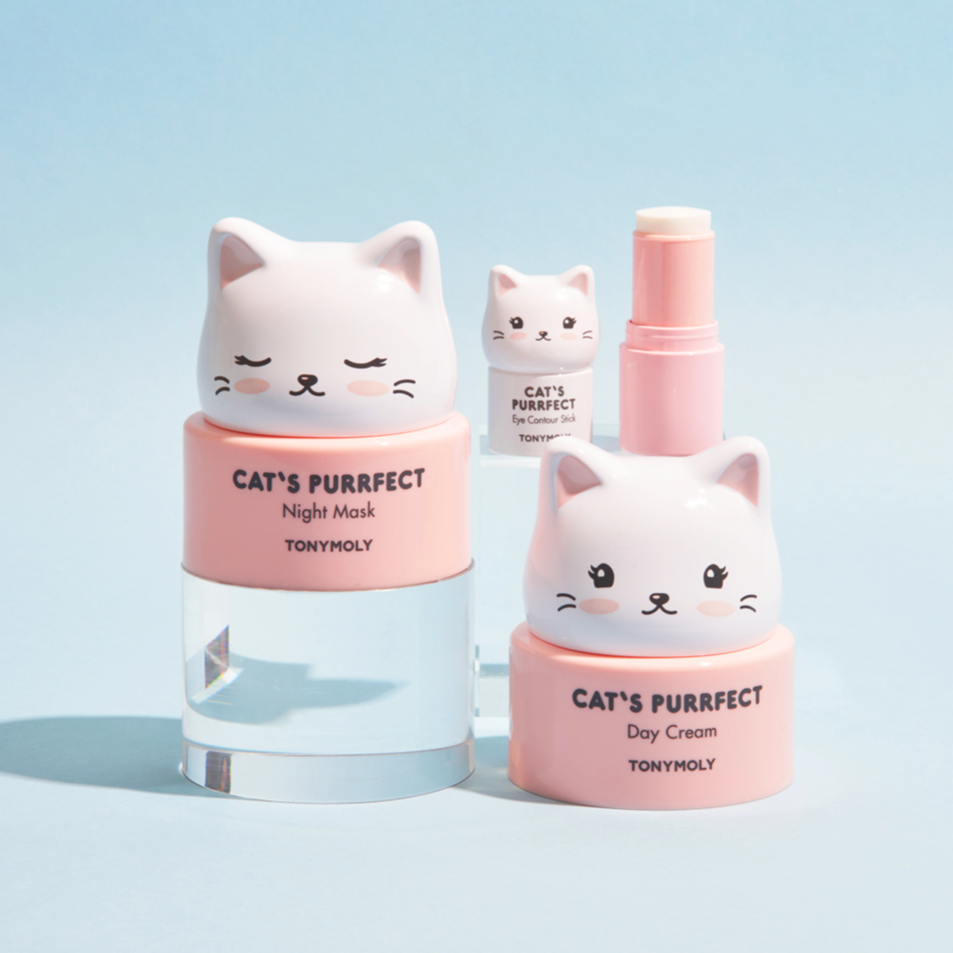Two cosmetic bottles with cat designs labeled 'Cat's Purrfect' on a light blue background.