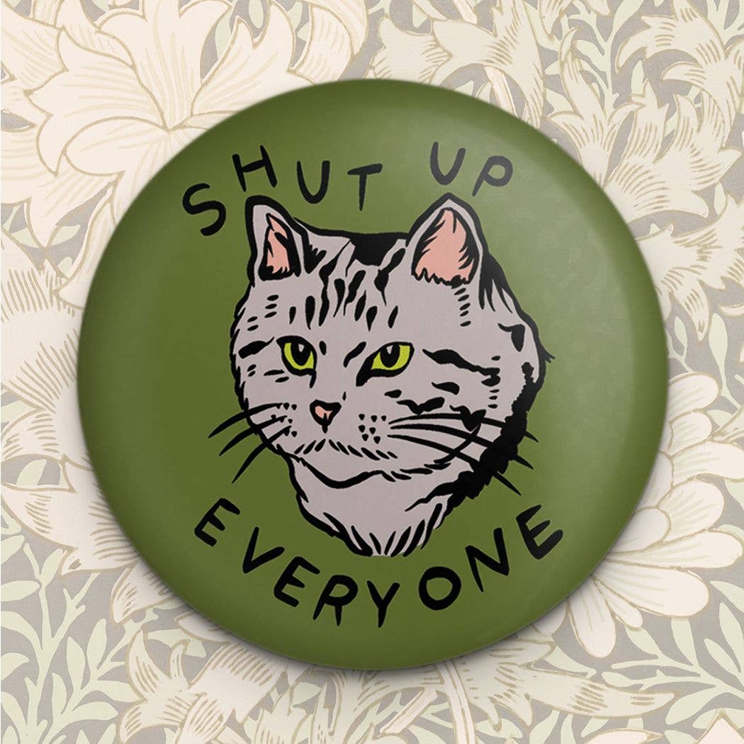 Button with a cat illustration and text 'SHUT UP EVERYONE' on a floral background