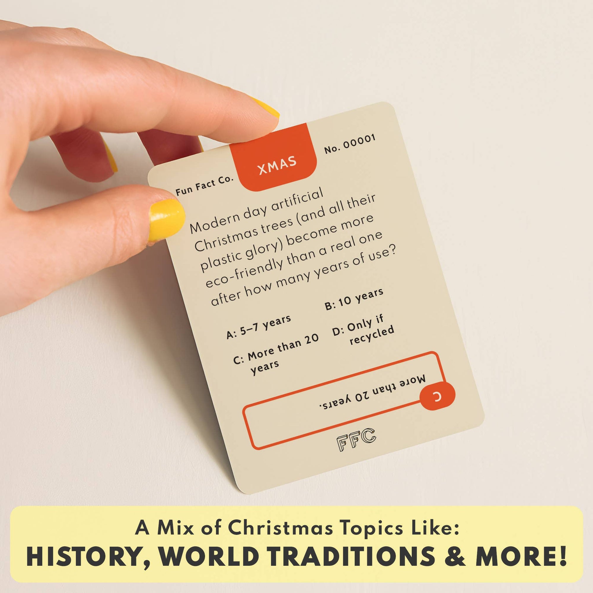 Card with Christmas-themed trivia question and hand holding it