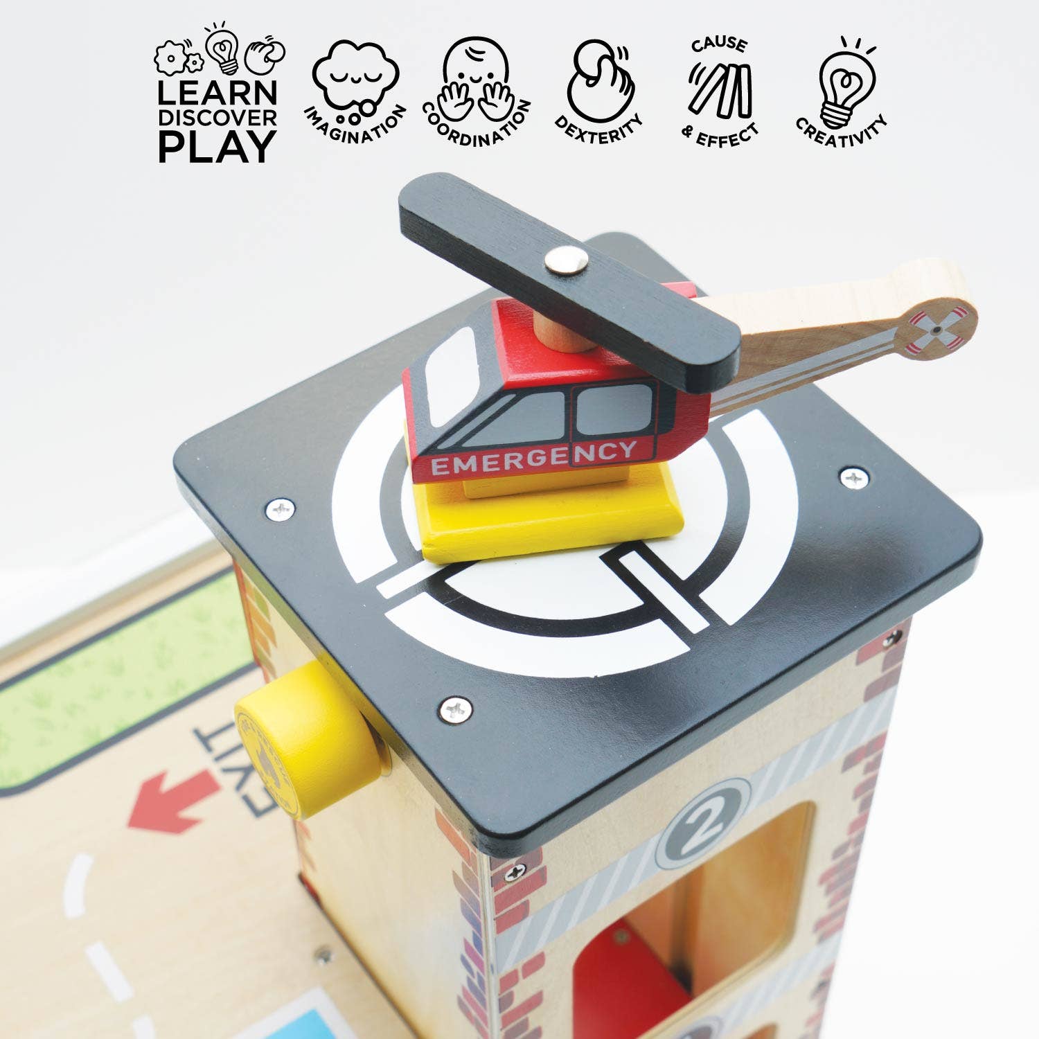 Toy fire truck with emergency sign on a white background, featuring icons of learning, discovery, and play.