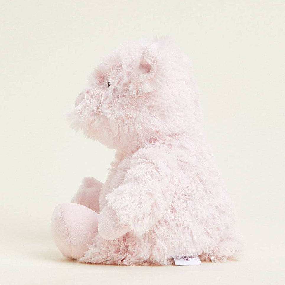 Fluffy pink plush toy on a light background