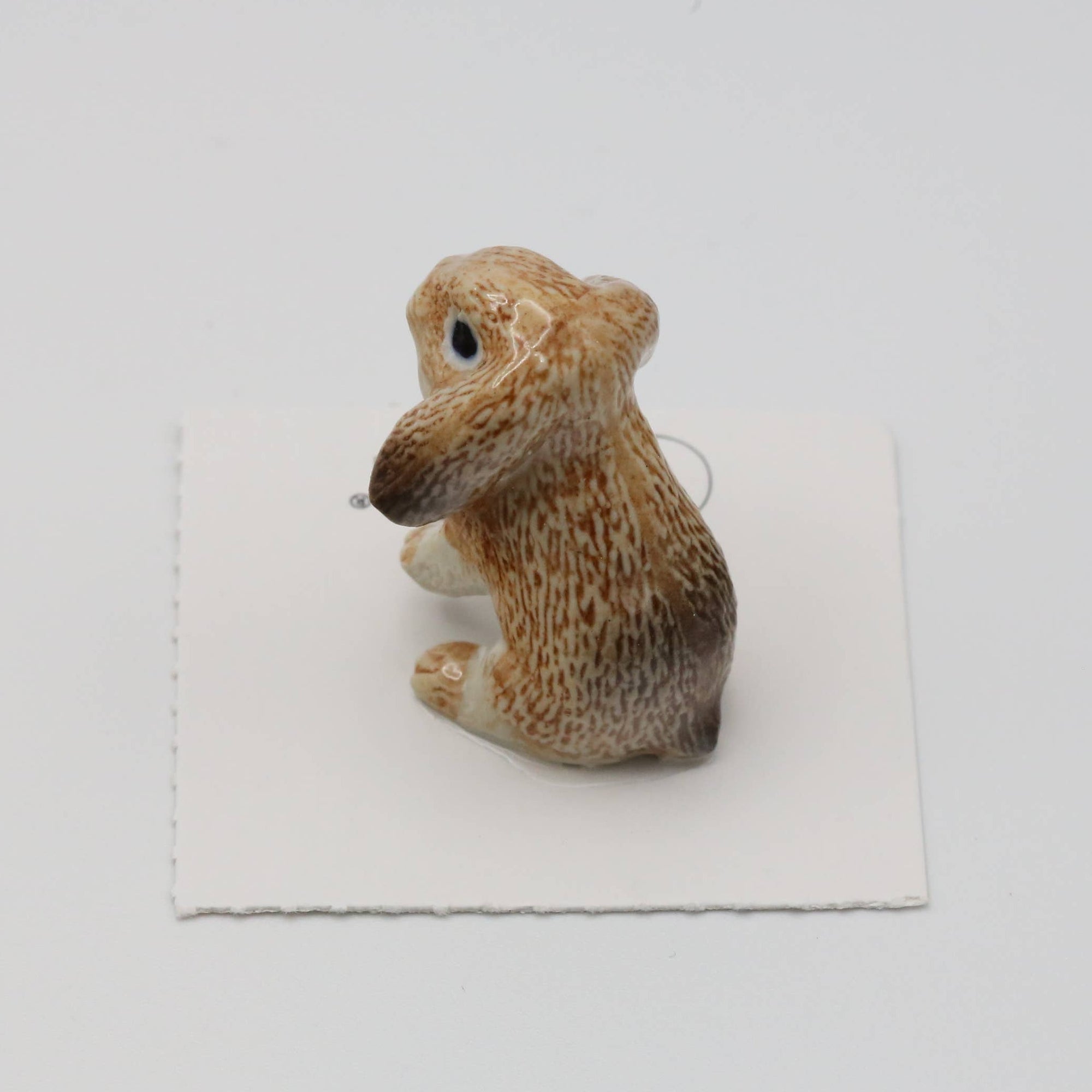 Small figurine of a rabbit on a white background