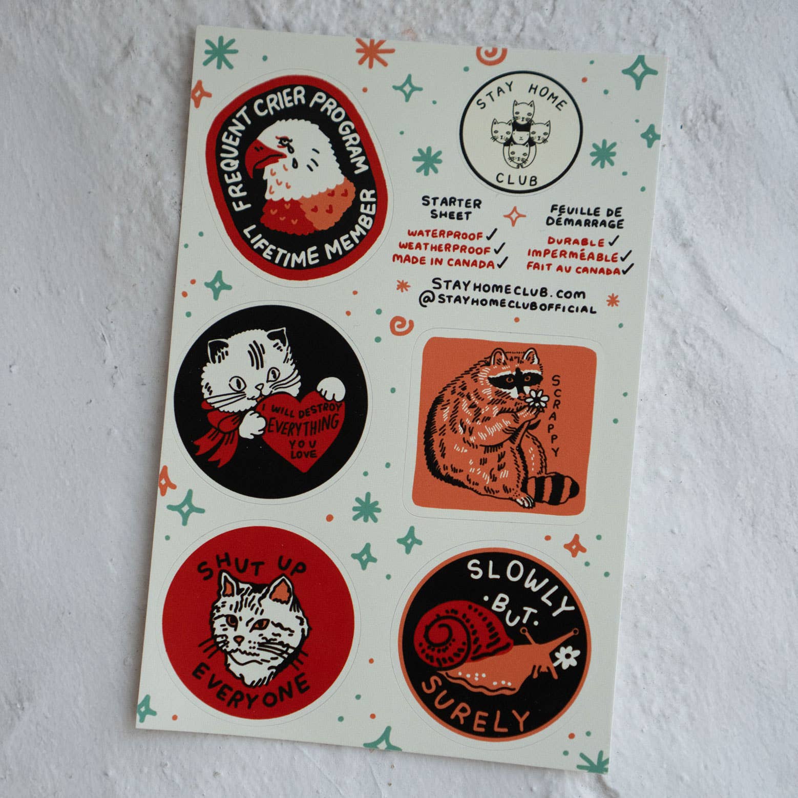 Sheet of cat-themed stickers with various designs on a white background