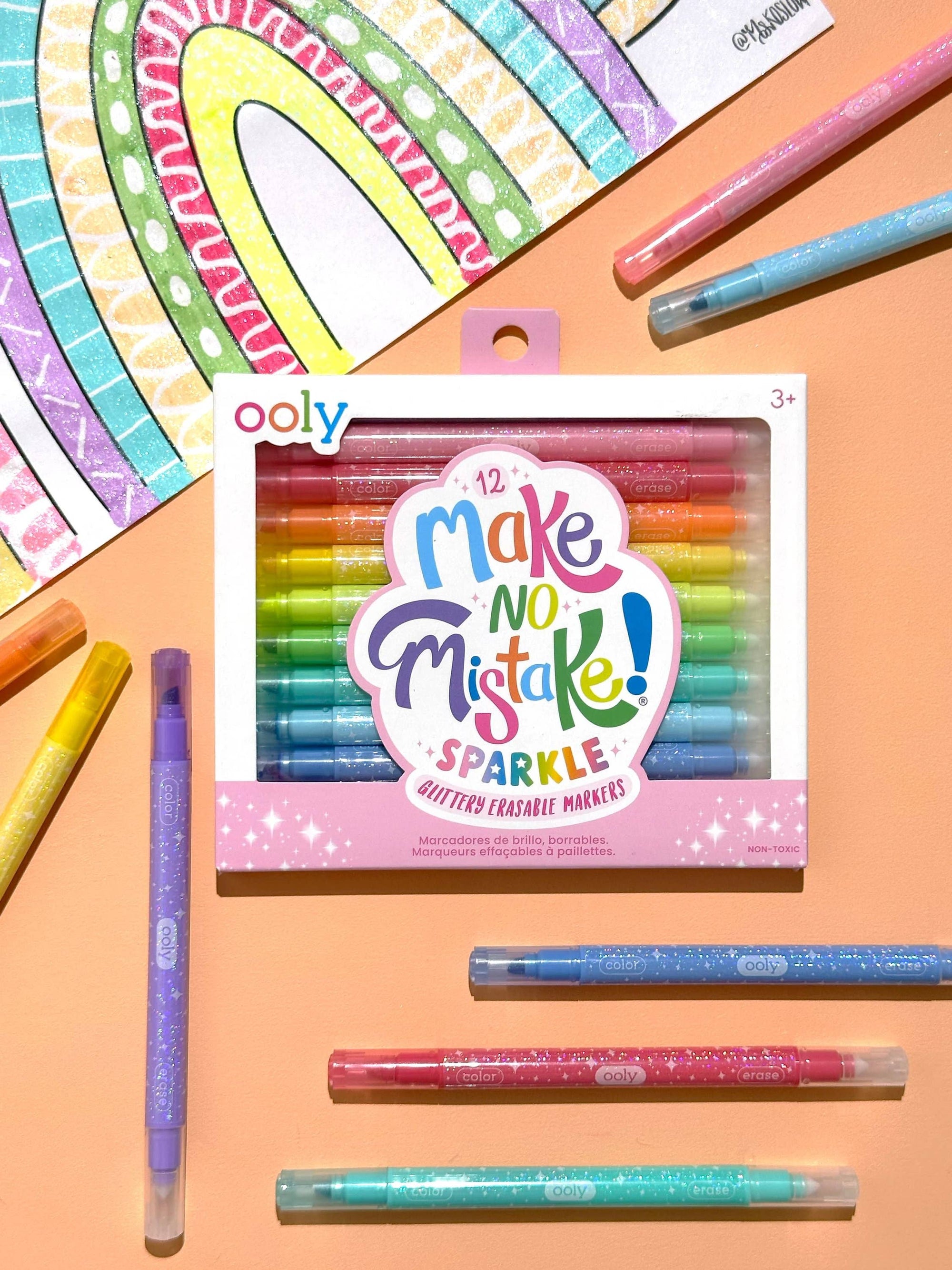 Packaging of Ooly 'Make No Mistake! Sparkle' markers with markers displayed on a colorful background
