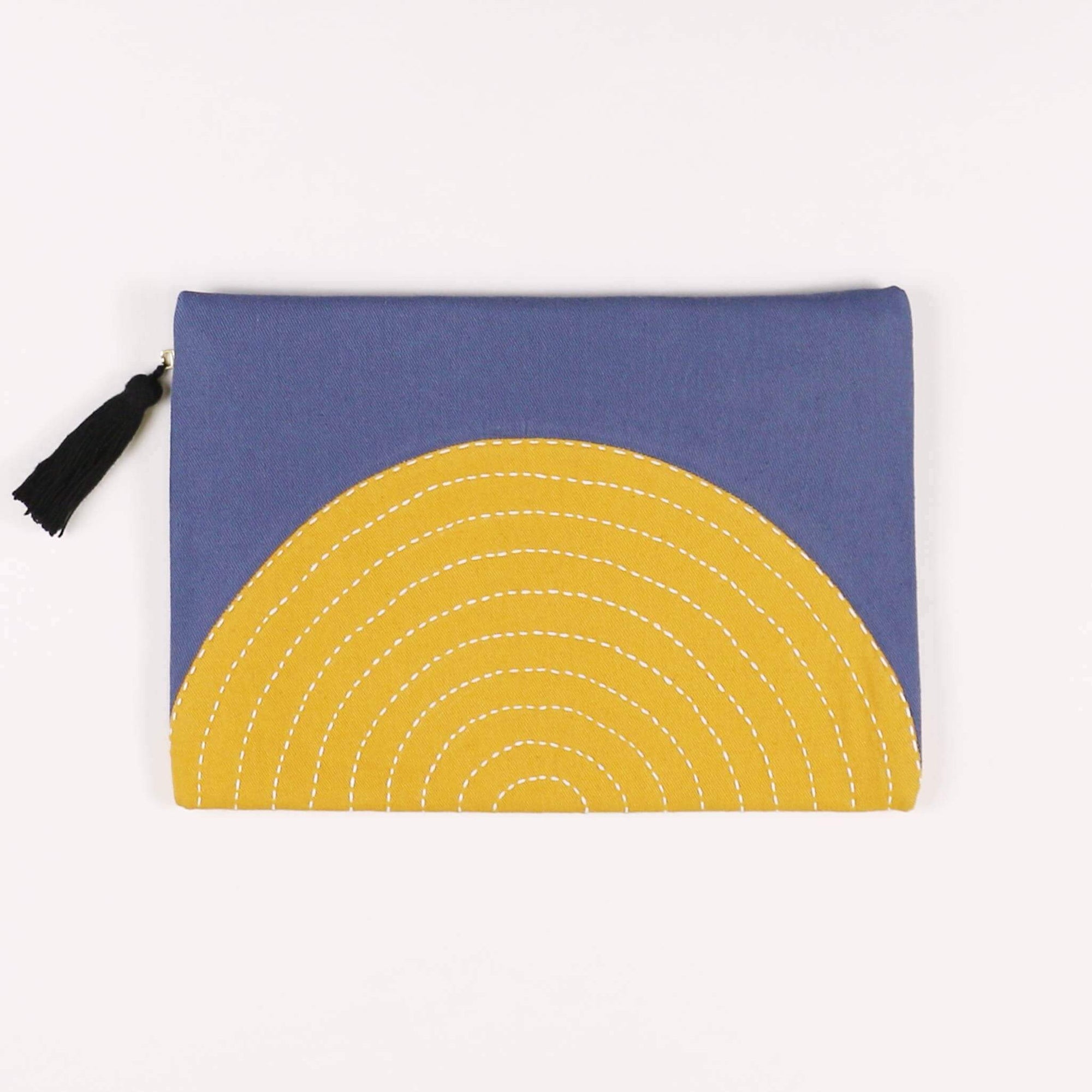 Blue pouch with yellow crescent moon design on a white background