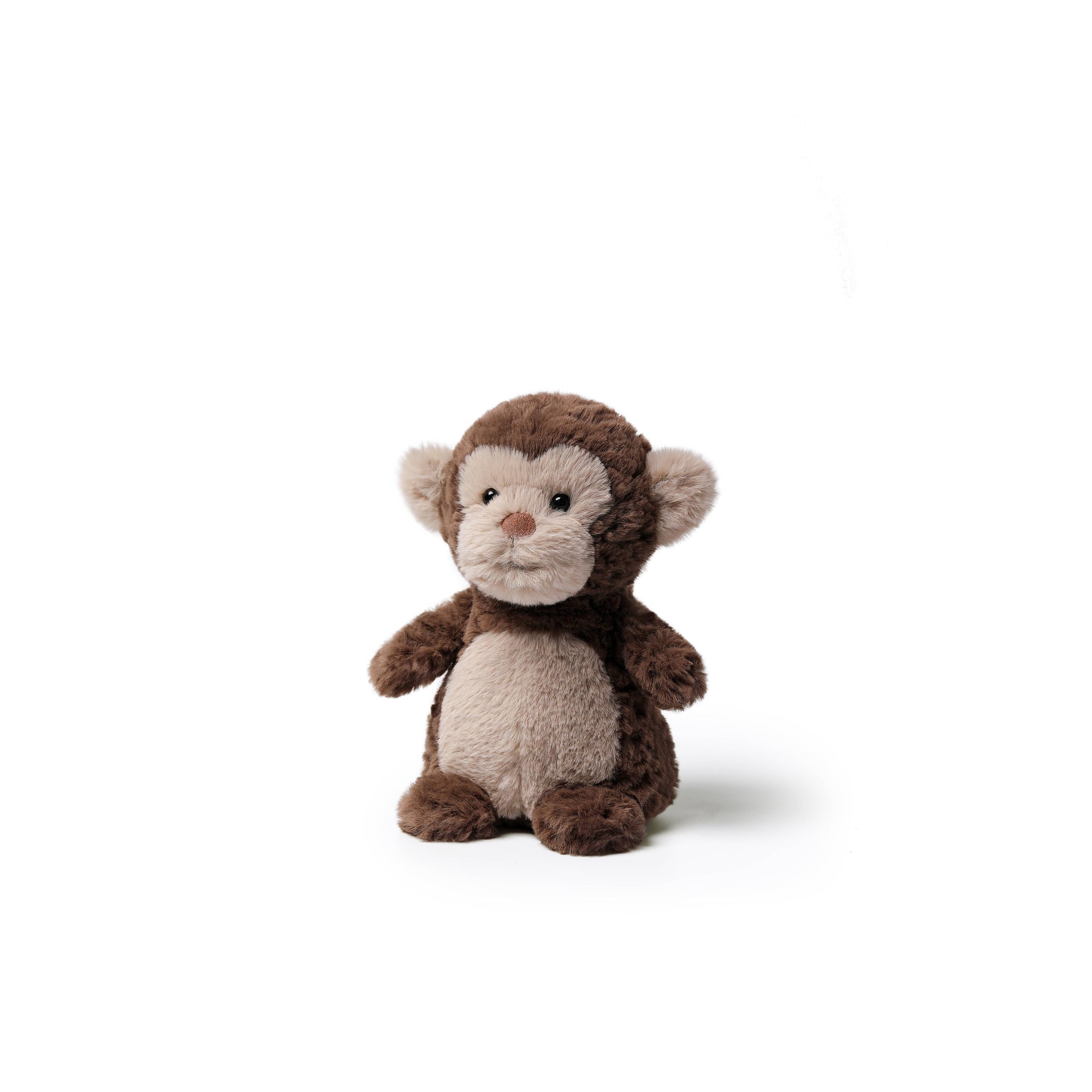 A small plush monkey toy sitting upright on a clean white background. The monkey has dark brown fur on its head, arms, and legs, with a lighter beige face, belly, and inner ears.
