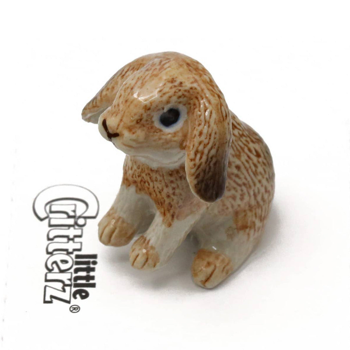 Small ceramic rabbit figurine with 'Little Critterz' branding on a white background