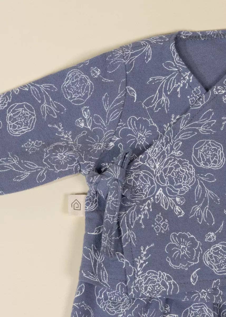 Blue floral patterned shirt on a beige background