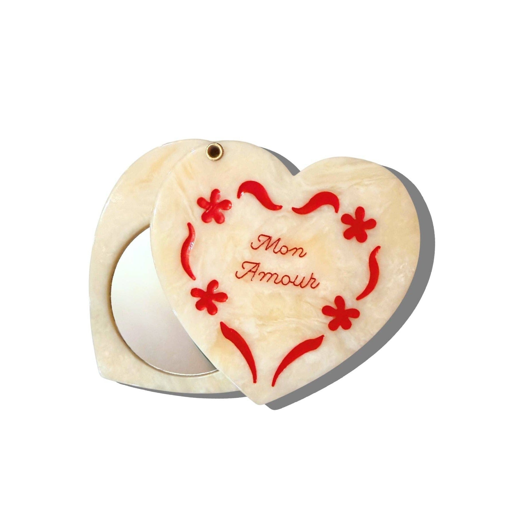 Heart-shaped wooden box with floral designs and 'Mon Amour' text on a white background
