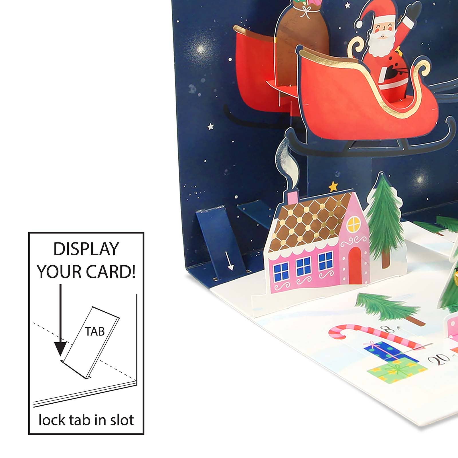 Pop-up card with Santa Claus in sleigh and Christmas scene, showing how to display the card.