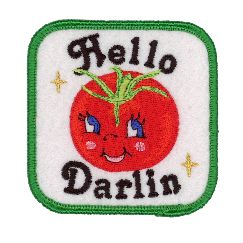 Embroidered patch with a tomato character and 'Hello Darlin' text on a white background