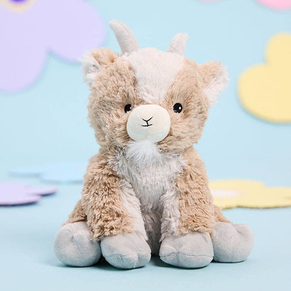 Plush toy llama with a pastel background