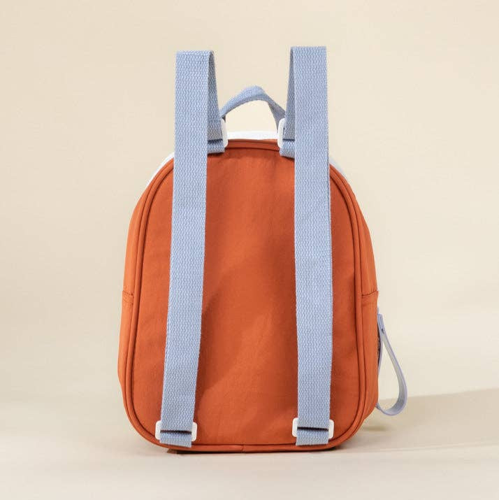 Orange backpack with blue straps on a beige background