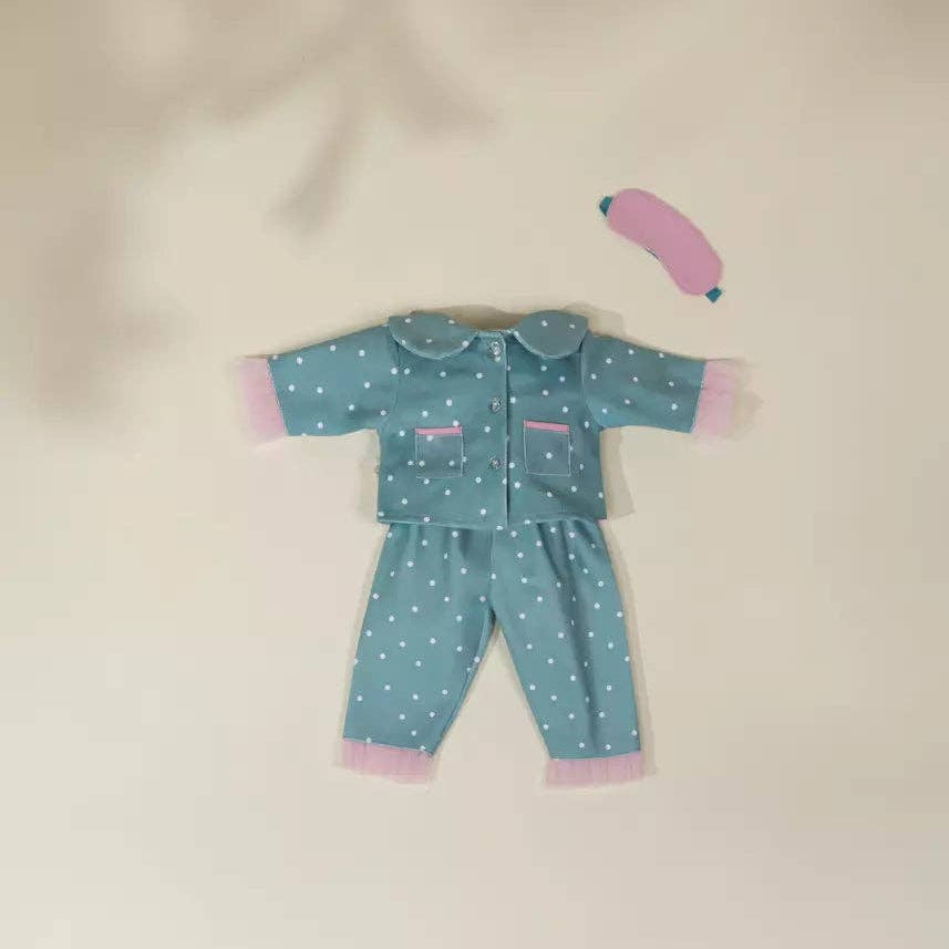 doll pajama set with polka dots on a beige background
