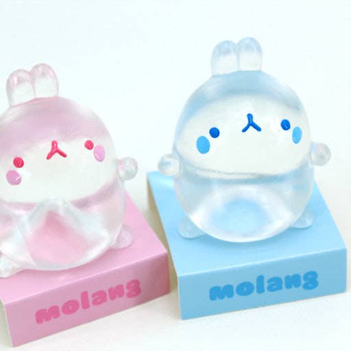 Two cute figurines on pink and blue bases with 'molang' branding.