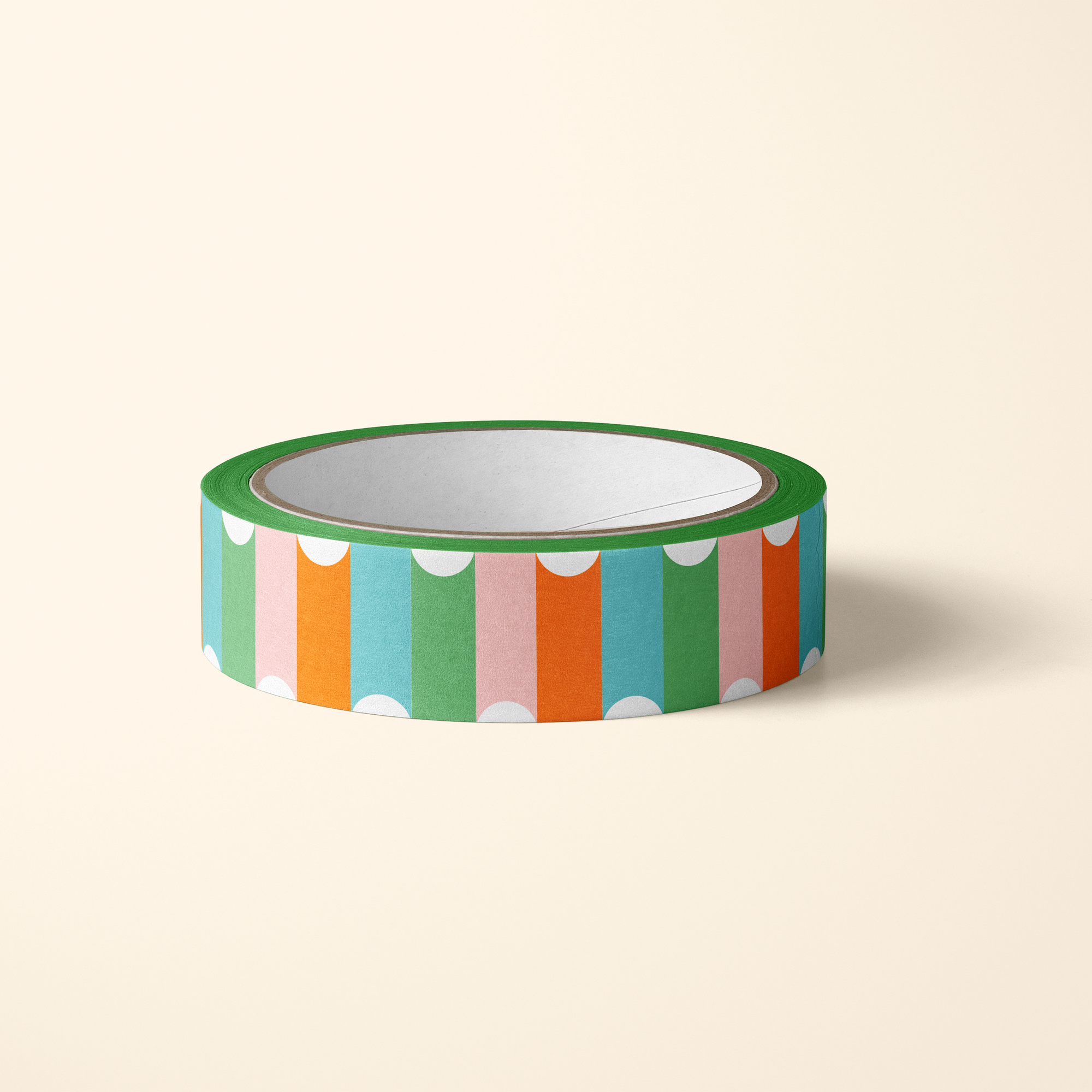 Roll of colorful striped tape on a beige background