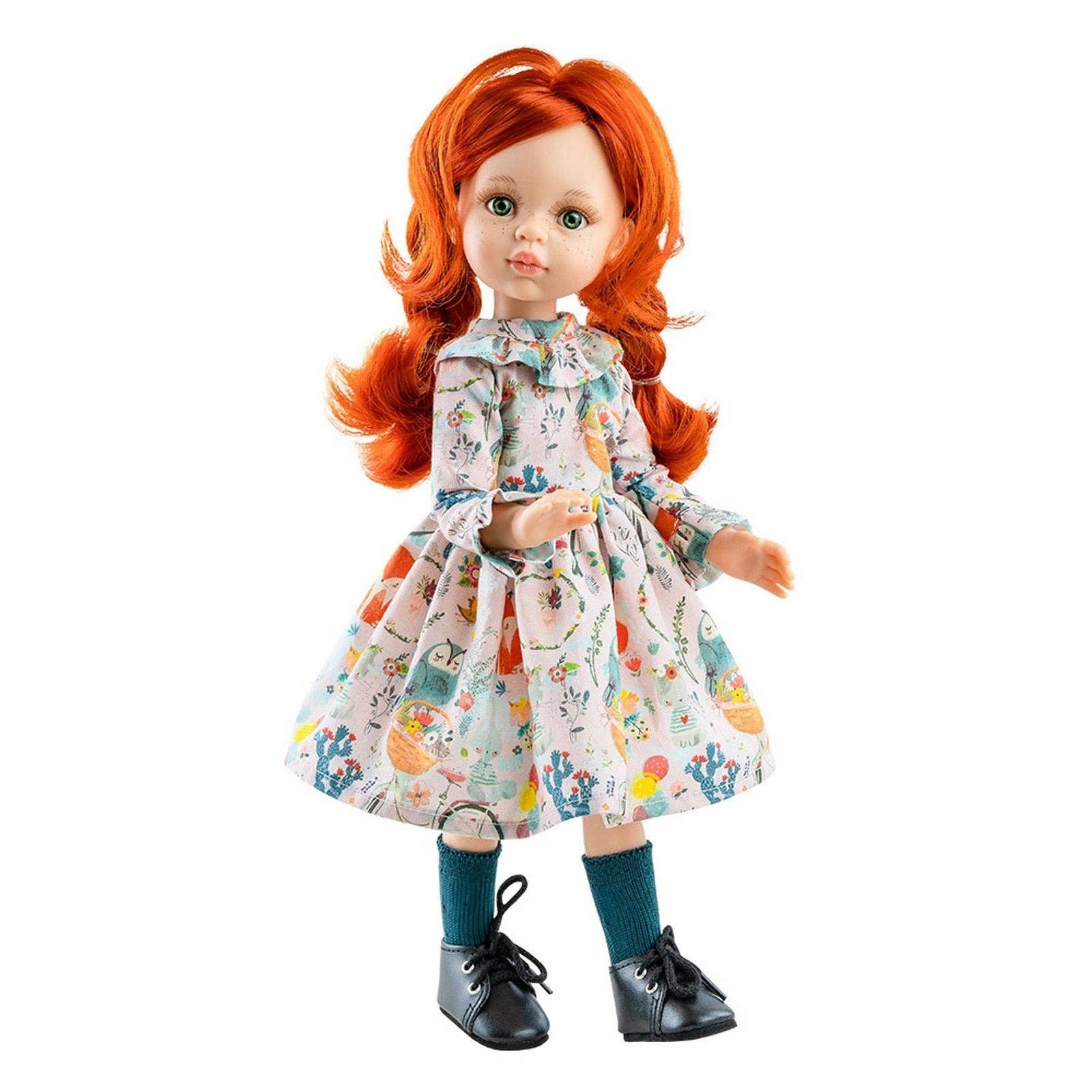 Doll with red hair and a floral dress on a white background