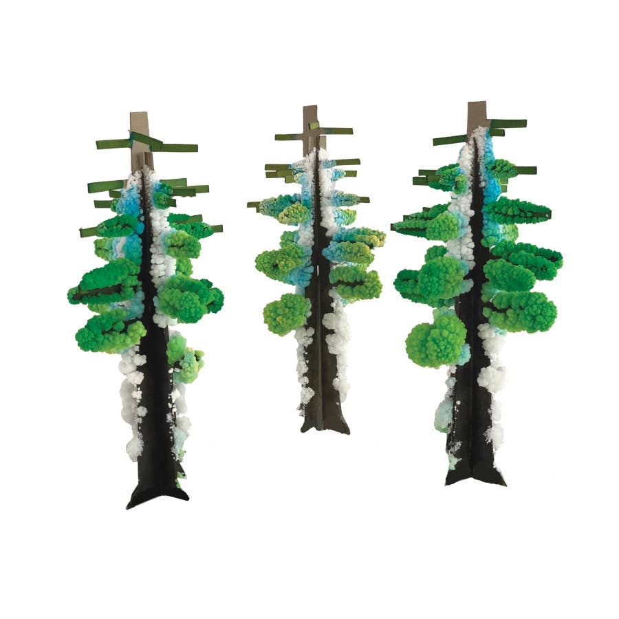 Three decorative trees with green foliage and white accents on a white background