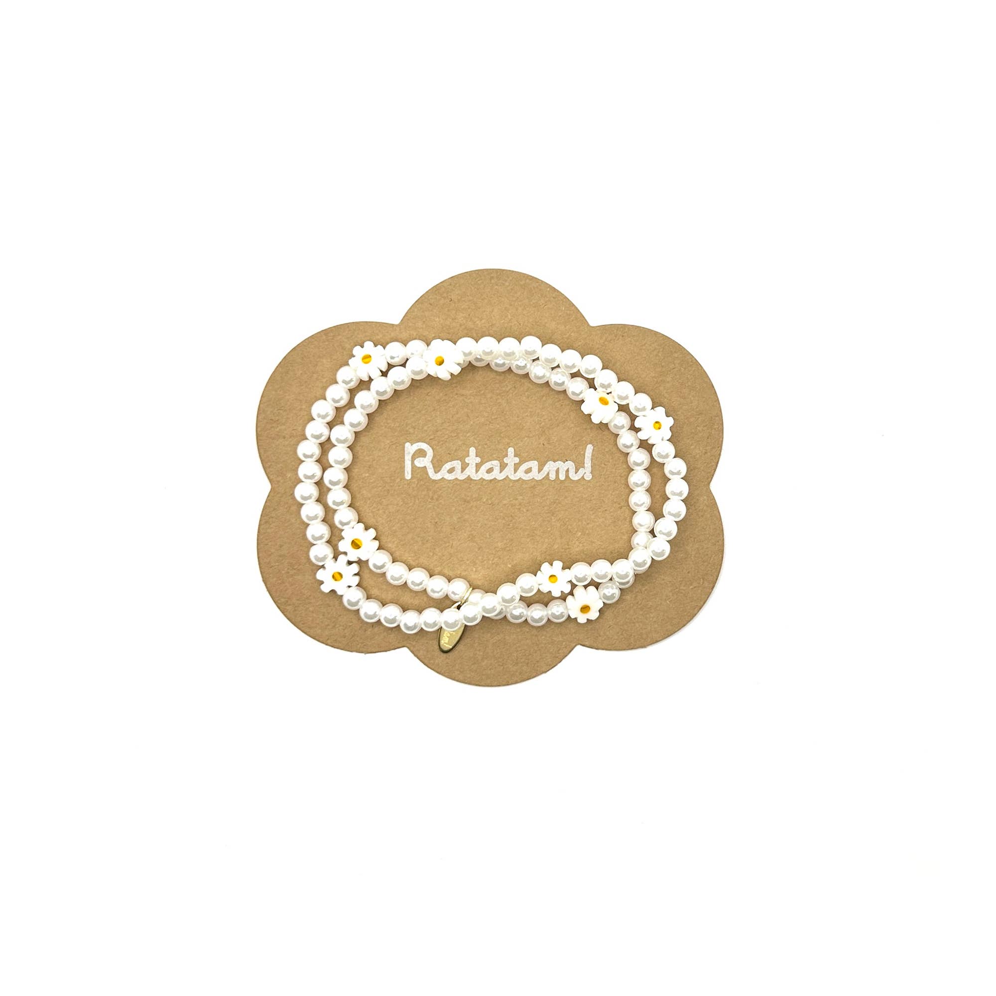 necklace with daisy flowers on a 'Ratatam!' branded card.