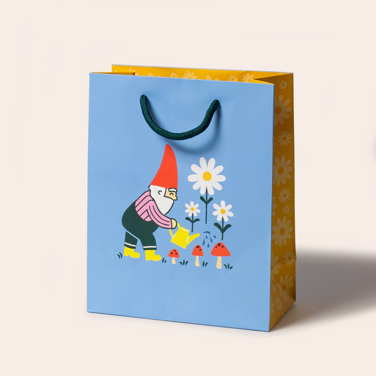 Gift bag with a gnome and flower design on a light blue background