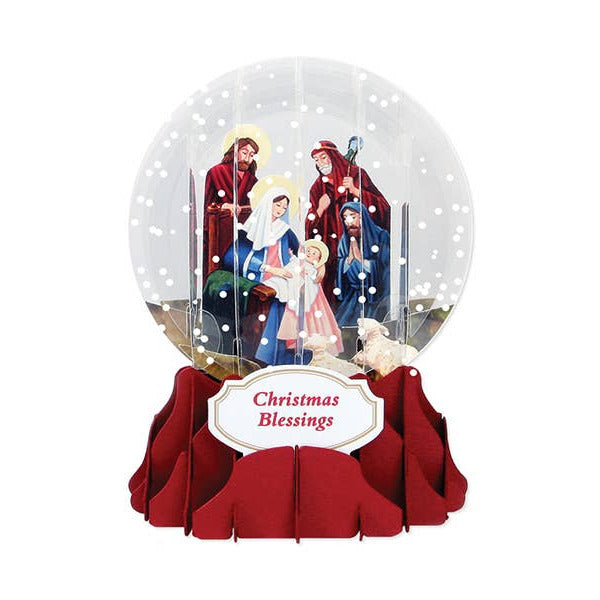 Christmas snow globe with nativity scene and 'Christmas Blessings' text on a white background