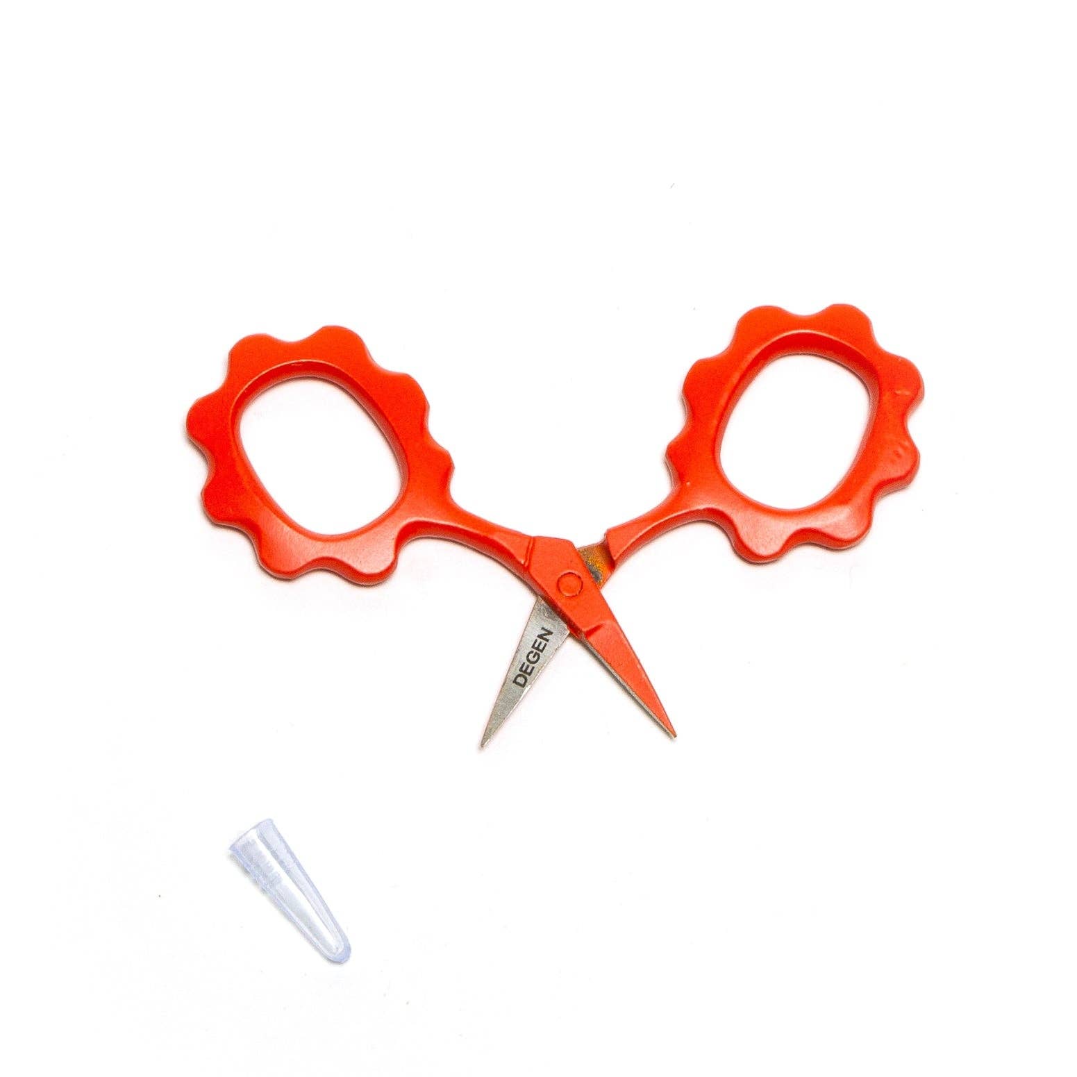 Orange scissors with a white background