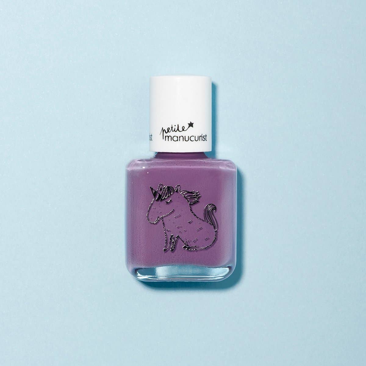 Purple nail polish bottle with a white cap on a light blue background