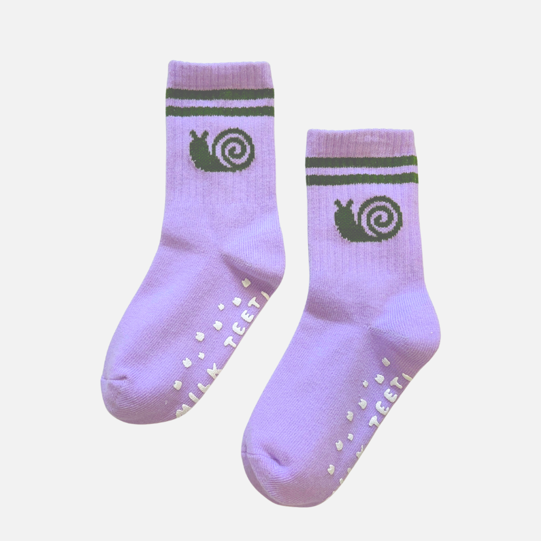 Pair of purple socks with green snail design on a white background