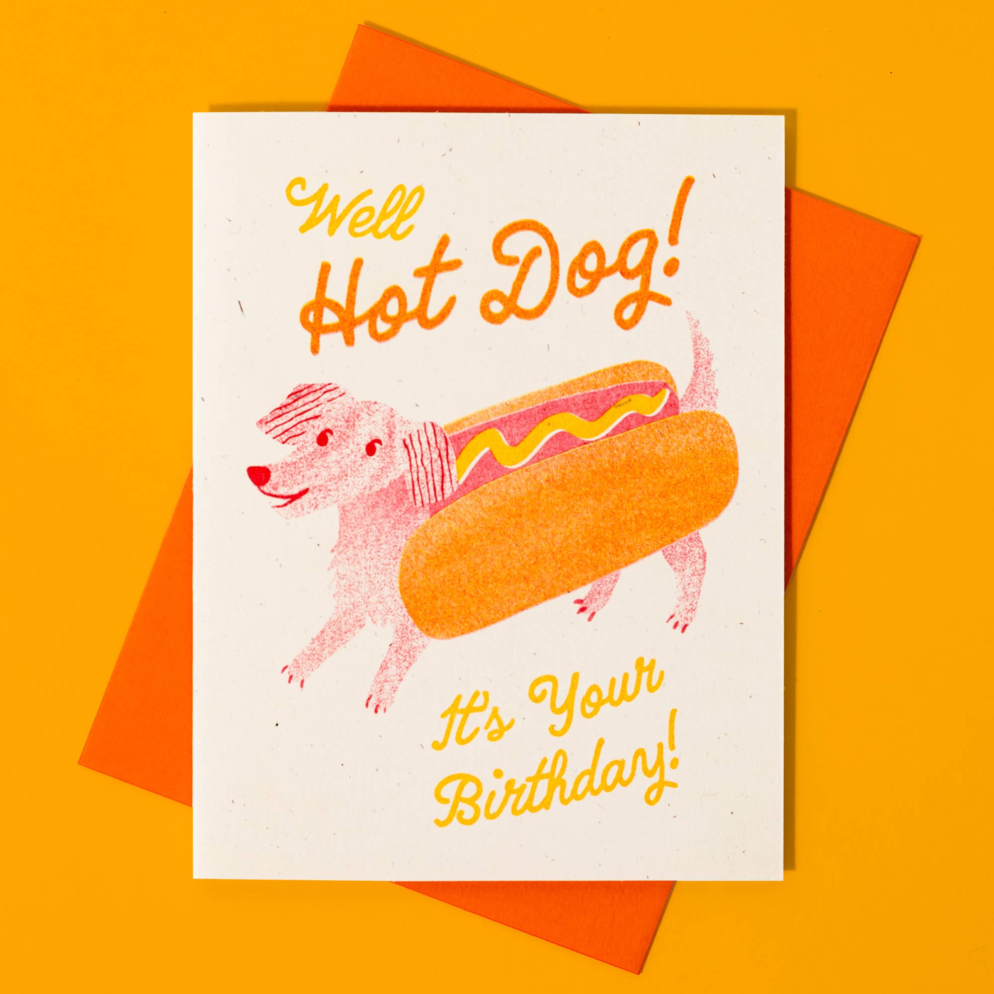 Birthday card with a dog in a hot dog costume on an orange background