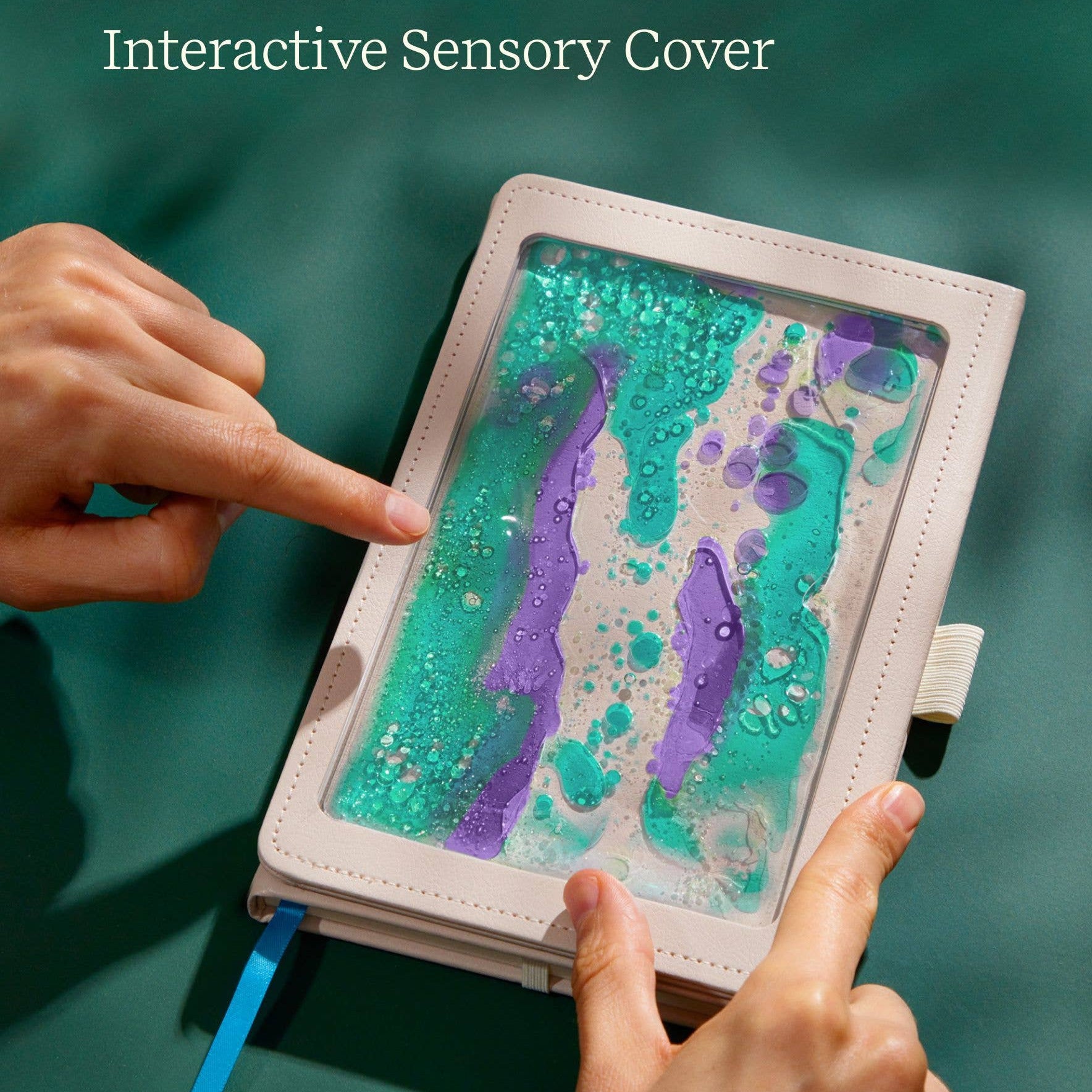 Interactive Sensory Cover with hands touching the colorful interior on a green background