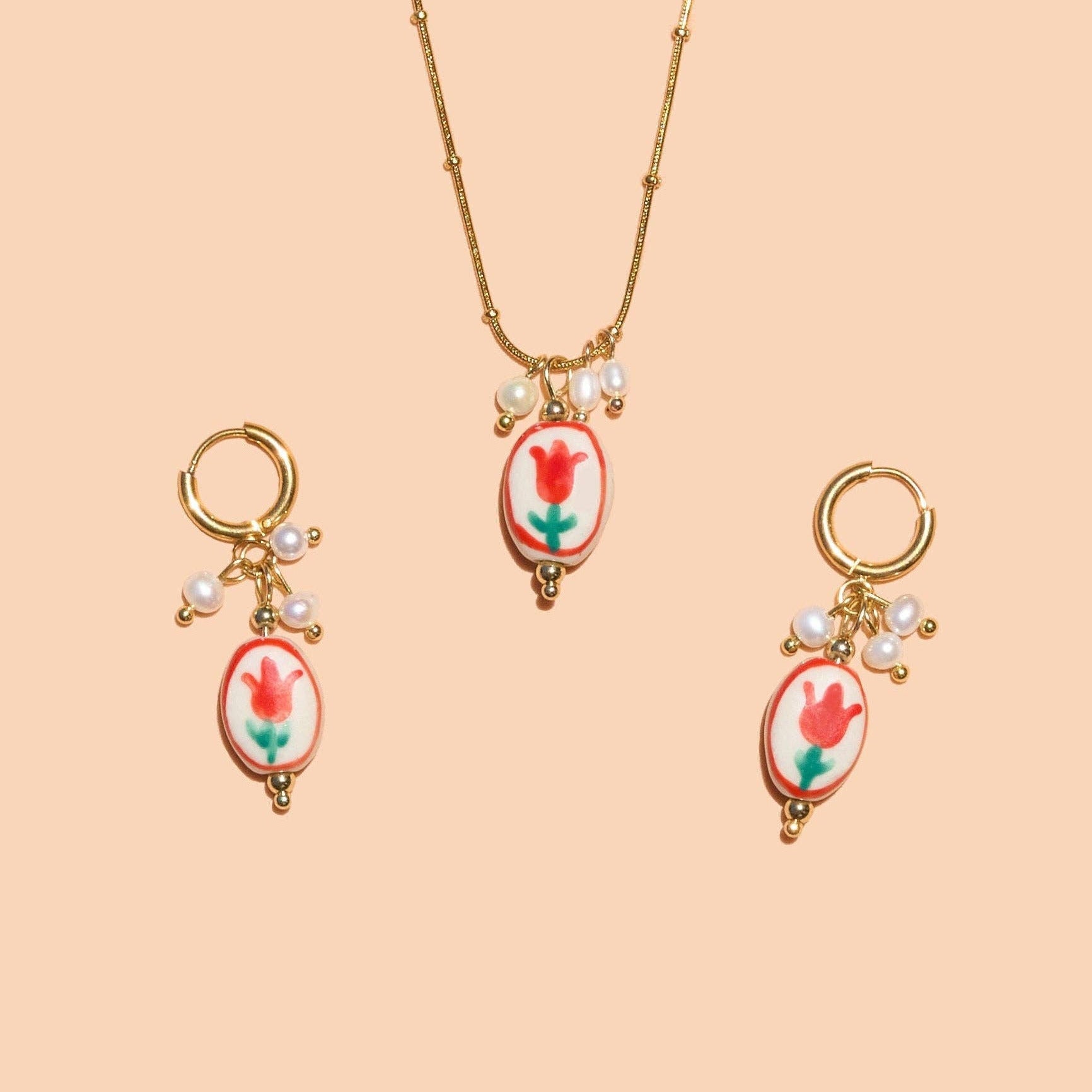 Jewelry set with necklace and earrings on a beige background