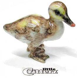 Small ceramic duck figurine on a white background with 'Little Critterz' branding.