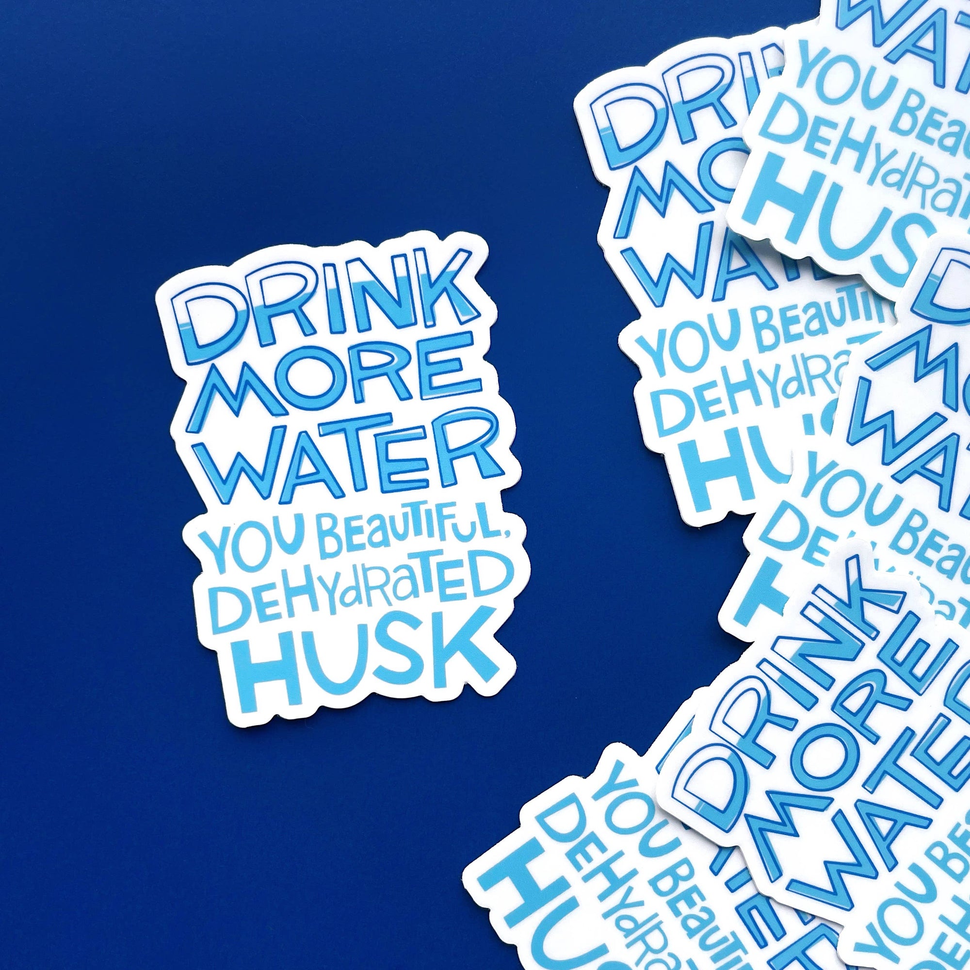 Stickers with humorous hydration text design on a blue background