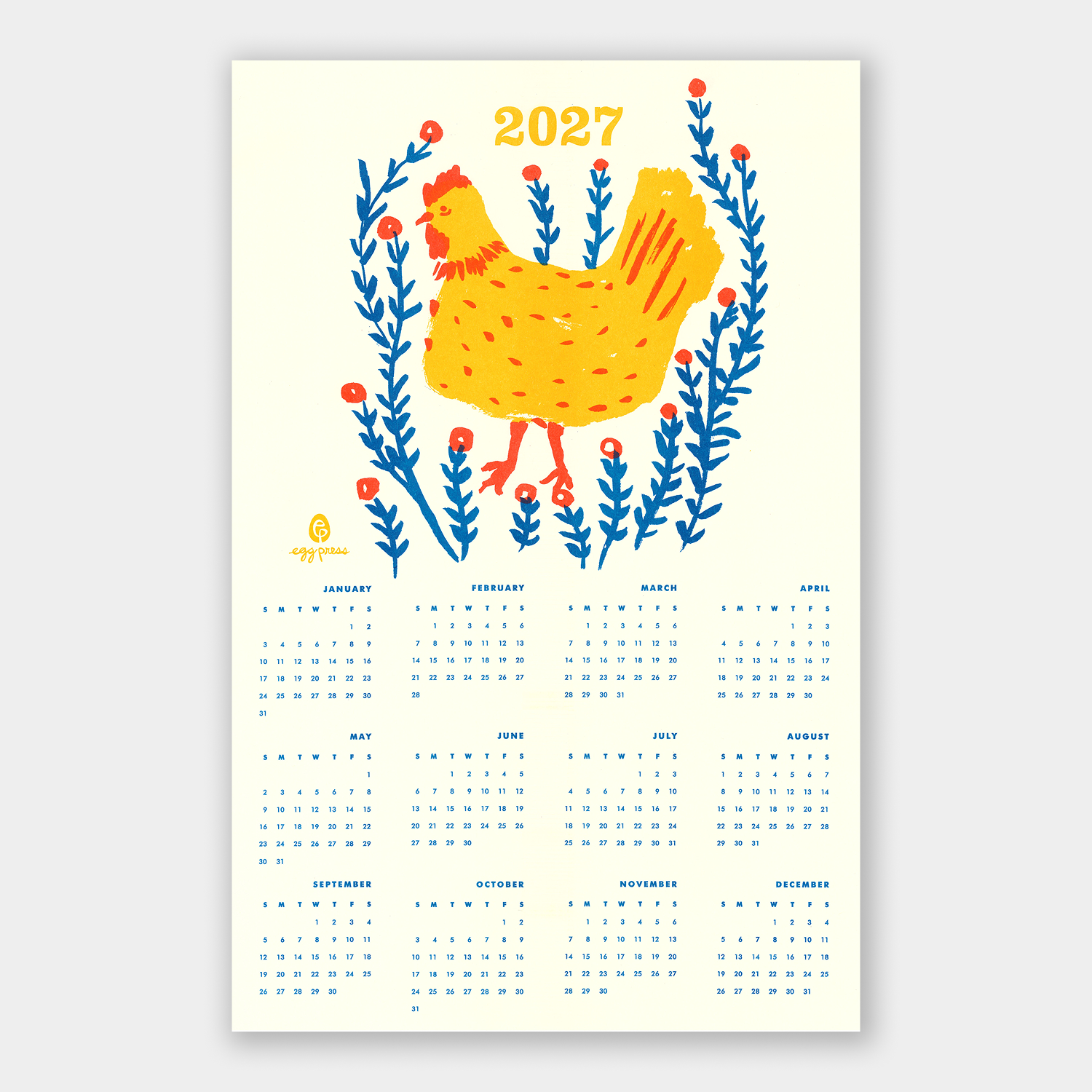 A 2027 wall calendar featuring a stylized yellow chicken surrounded by blue flowers on a cream background, with the twelve monthly calendar grids printed below in blue text.