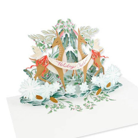Pop-up card with reindeer and foliage design on a white background