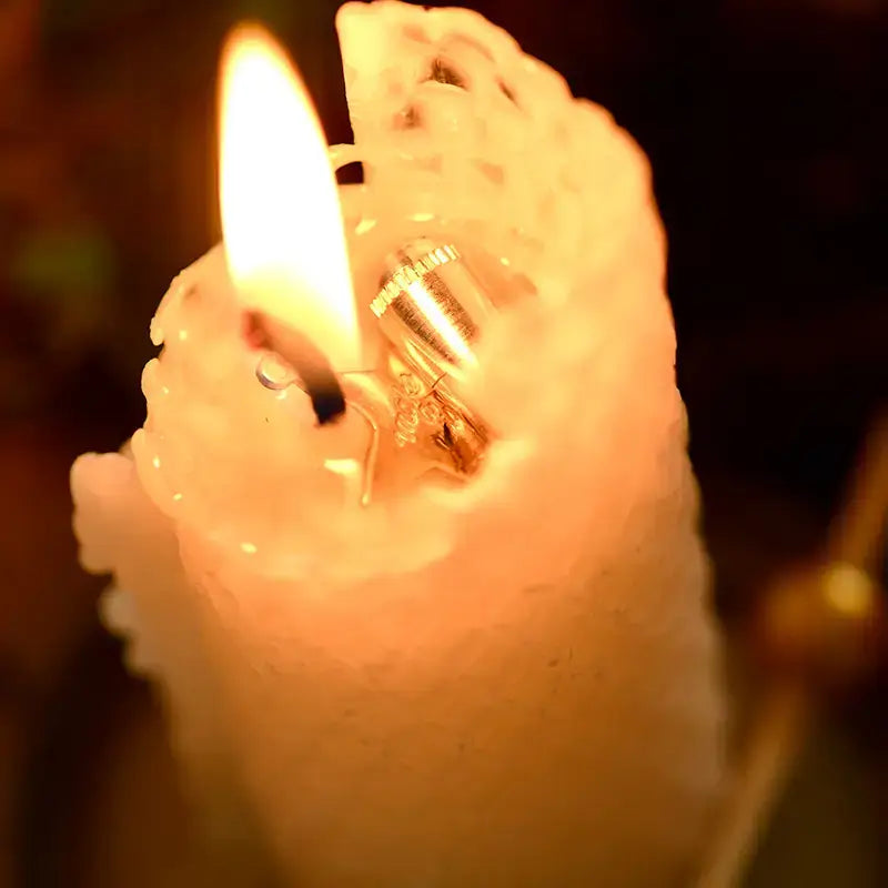 Close-up of a lit candle with a blurred background