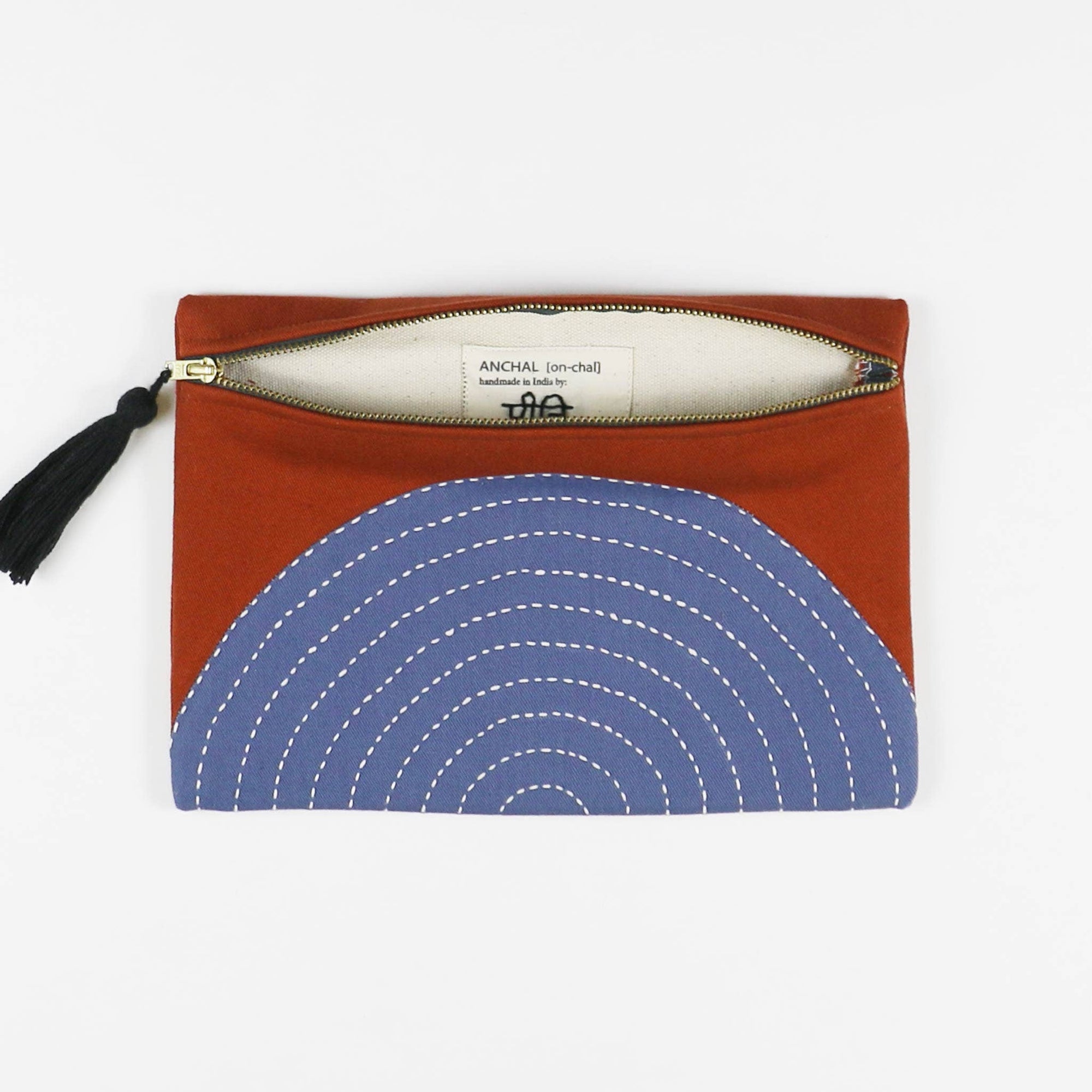 Brown pouch with blue circular pattern on a white background