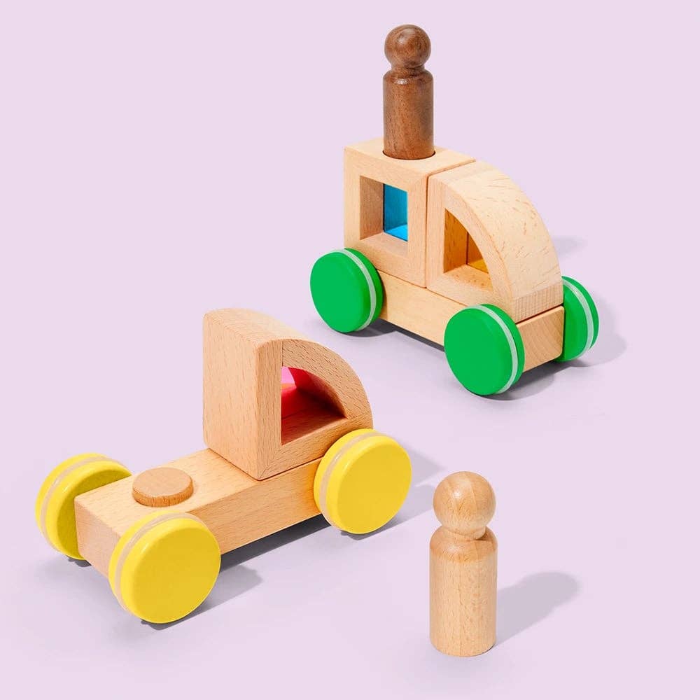 Two wooden toy cars with colorful wheels on a light purple background